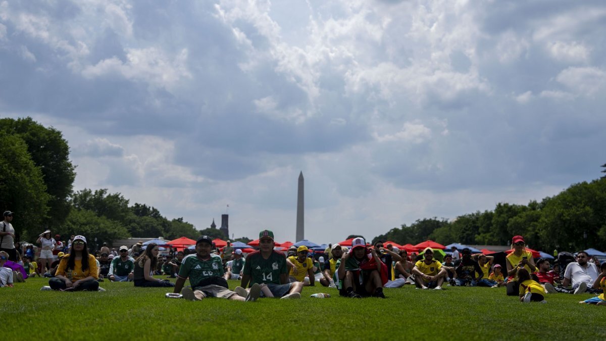 Soccer fans gather at the eastern end of the National Mall in Washington on Thursday to watch the first game of the 2026 FIFA World Cup taking place in Mexico City shortly before authorities condoned off an area at the other end of the mall after finding "8647" imprinted in the grass. Photo by Bonnie Cash/UPI