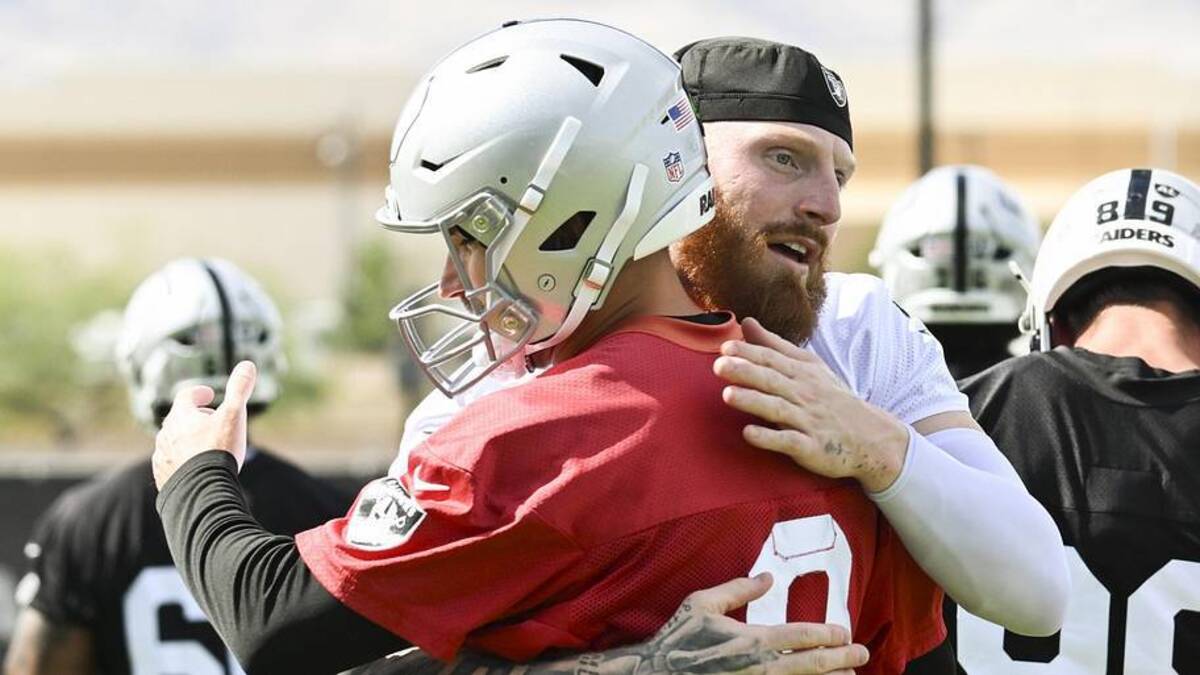  Jun 3, 2026; Henderson, NV, USA; Las Vegas Raiders defensive end Maxx Crosby (98) hugs quarterback Kirk Cousins (8) during organized team activities at Intermountain Health Performance Center. Mandatory Credit: Candice Ward-Imagn Images | Candice Ward-Imagn Images 