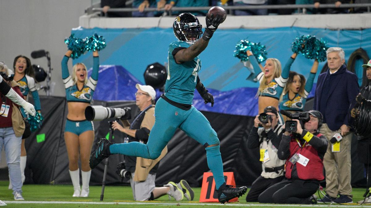 Jacksonville Jaguars linebacker Josh Allen (41) returns a fumble for a touchdown in the second half of an NFL football game against the Tennessee Titans, Saturday, Jan. 7, 2023, in Jacksonville, Fla. (AP Photo/Phelan M. Ebenhack)