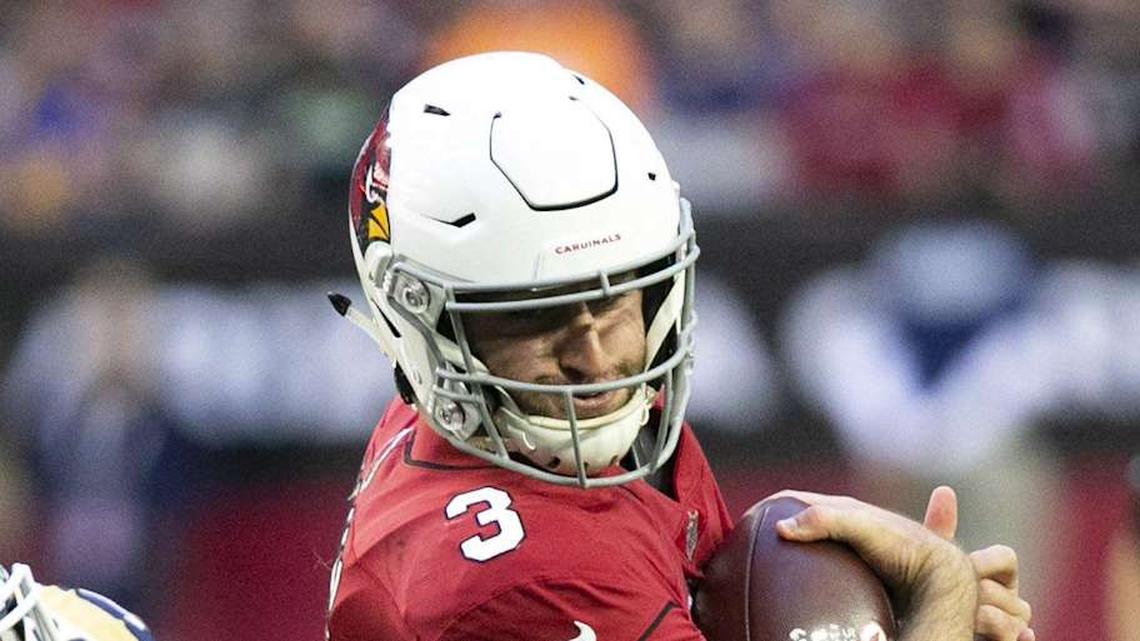  Cardinals quarterback Josh Rosen tries to escape a tackle from Rams linebacker Cory Littleton during a game at State Farm Stadium on Dec. 23. Cardinals Rams | David Wallace/The Republic 