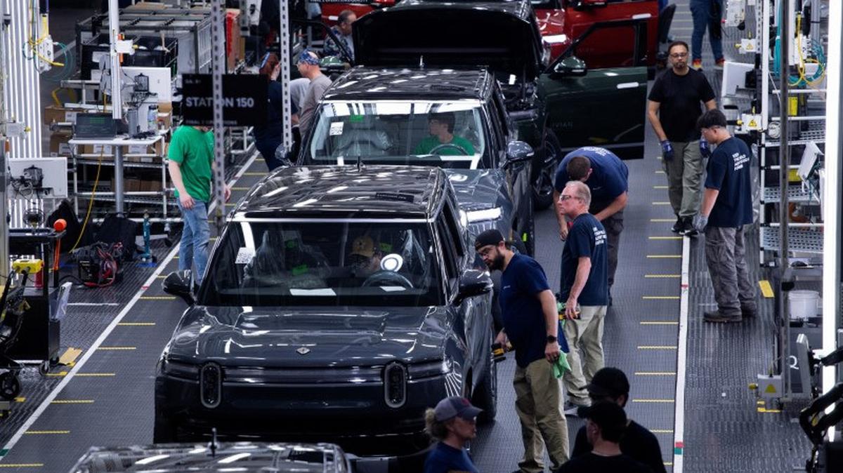 Workers assemble second-generation R1 vehicles at electric auto maker Rivian's manufacturing facility in Normal, Illinois, U.S. June 21, 2024.  REUTERS/Joel Angel Juarez