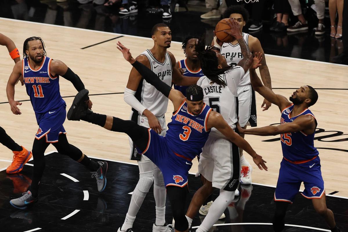  Jun 5, 2026; San Antonio, Texas, USA; San Antonio Spurs guard Stephon Castle (5) shoots the ball over New York Knicks guard Josh Hart (3) in the first half during game two of the 2026 NBA Finals at Frost Bank Center. Mandatory Credit: Geoff Burke-Imagn Images 