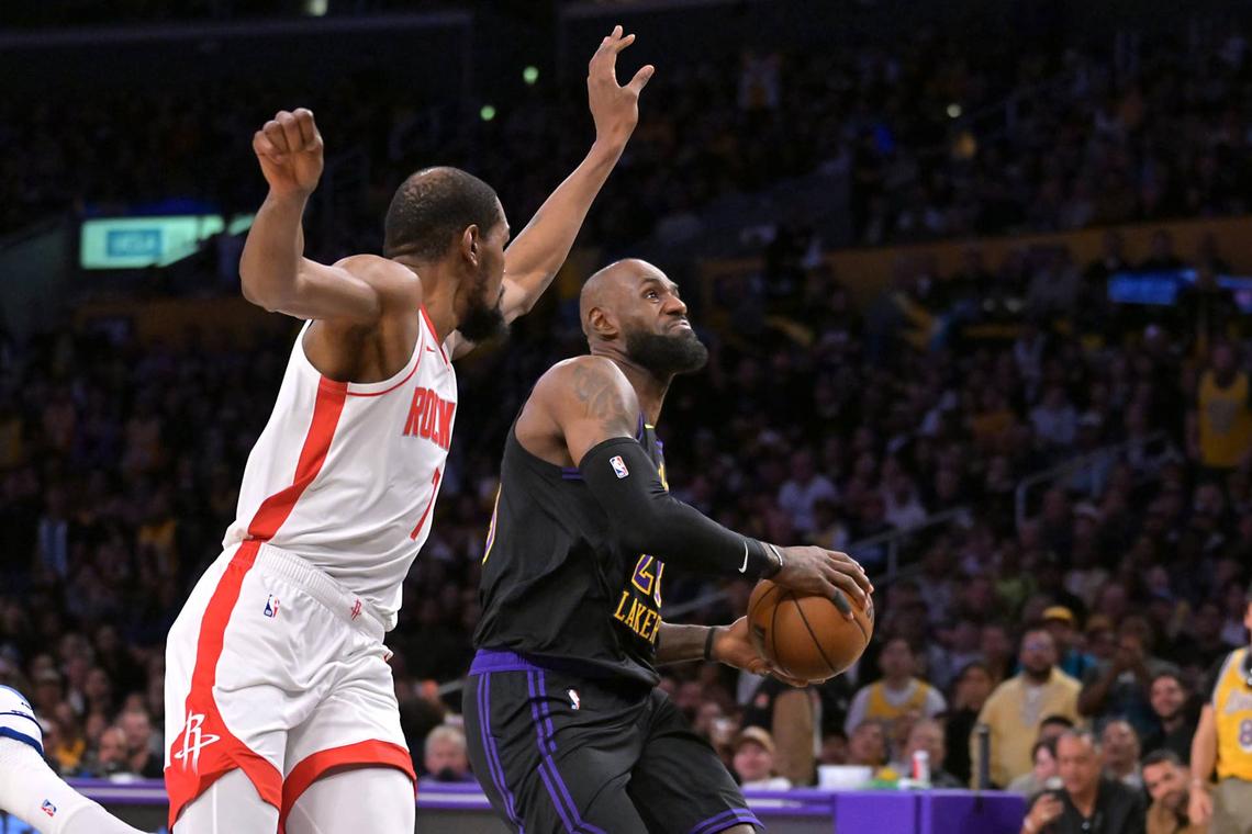  Apr 21, 2026; Los Angeles, California, USA; Los Angeles Lakers forward LeBron James (23) drives past Houston Rockets forward Kevin Durant (7) in the first half of game two of the first round of the 2026 NBA Playoffs against the Houston Rockets at Crypto.com Arena. Mandatory Credit: Jayne Kamin-Oncea-Imagn Images 
