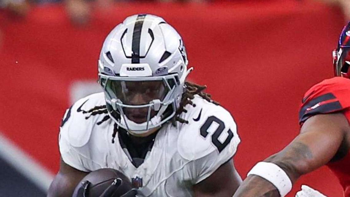  Dec 21, 2025; Houston, Texas, USA; Las Vegas Raiders running back Ashton Jeanty (2) rushes against the Houston Texans linebacker E.J. Speed (45) in the first quarter at NRG Stadium. Mandatory Credit: Thomas Shea-Imagn Images | Thomas Shea-Imagn Images 