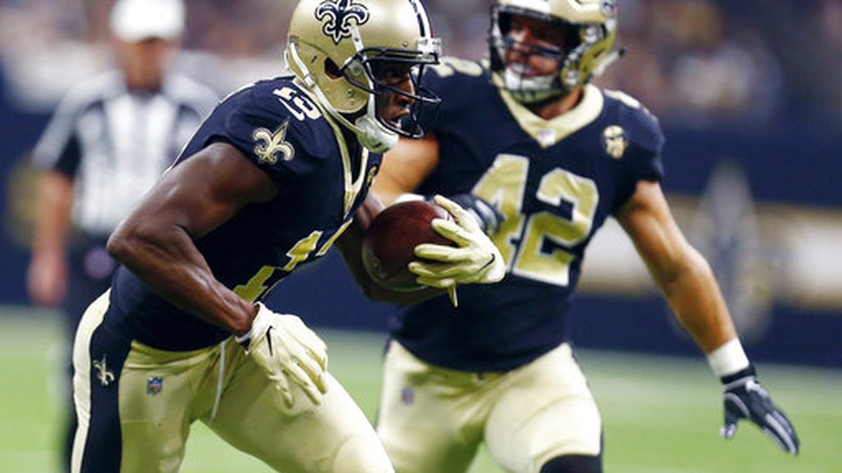 In this Sunday, Sept. 9, 2018, file photo, New Orleans Saints wide receiver Michael Thomas (13) carries on a pass reception in the first half of an NFL football game against the Tampa Bay Buccaneers in New Orleans. Thomas has 28 receptions after two games, the most through the first two games in NFL history.