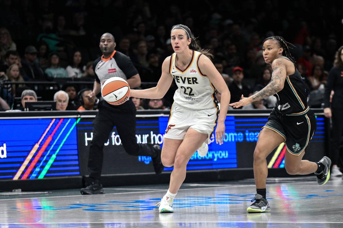  Indiana Fever guard Caitlin Clark (22) dribbles past New York Liberty guard Ny'ceara Pryor (1) during the first half at Barclays Center. John Jones-Imagn Images