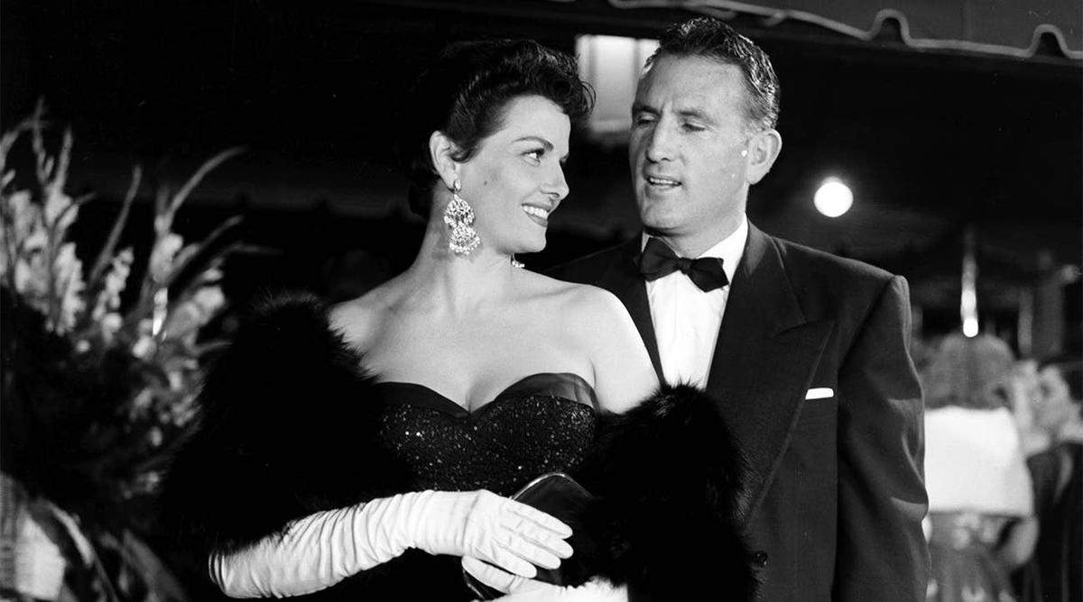  Jane Russell with her husband Bob Waterfield in red carpet appearance, circa 1955. (Credit: Michael Ochs Archives/Getty Images)