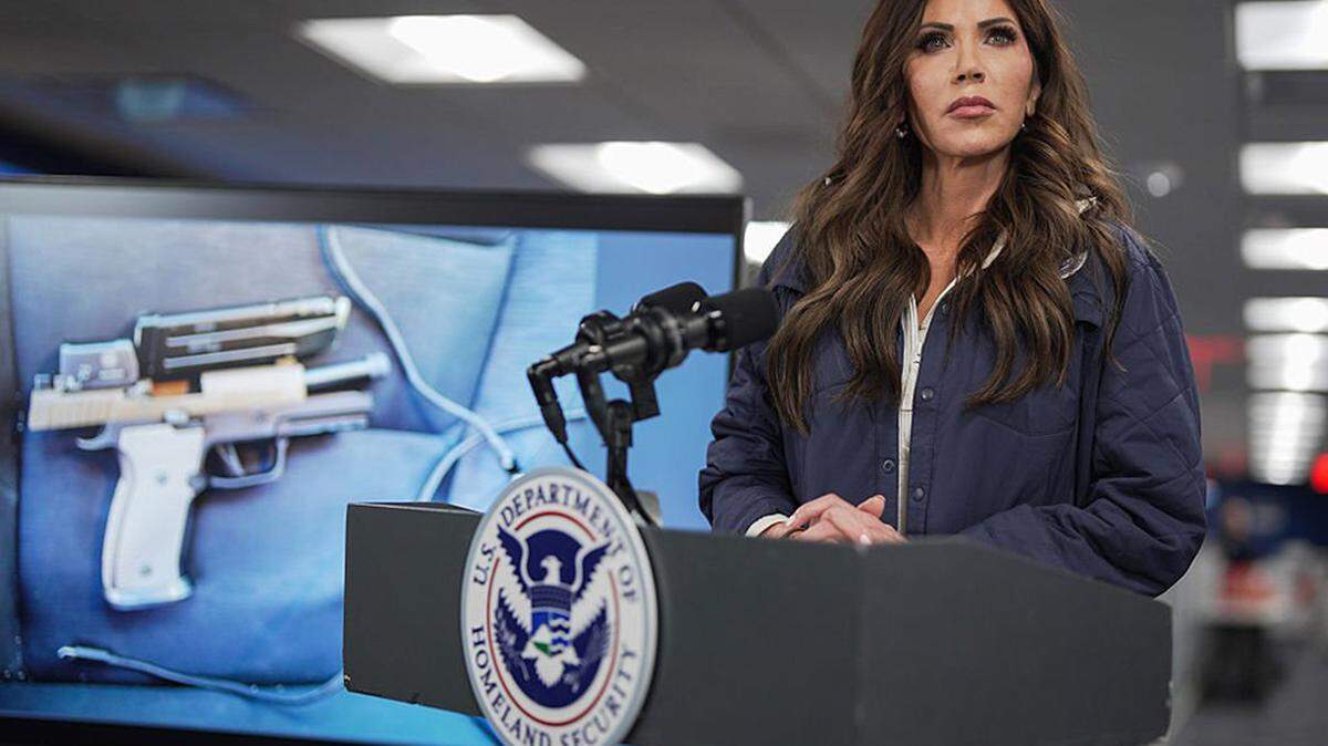 A photograph of a recovered pistol after a federal immigration agent shot and killed a U.S. citizen in Minneapolis is shown on a screen behind U.S. Secretary of Homeland Security Kristi Noem as she speaks during a news conference the Federal Emergency Management Agency headquarters in Washington on Saturday.