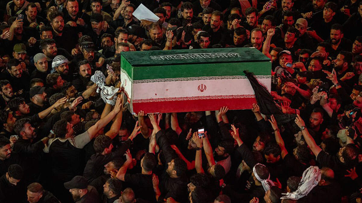 Mourners hold the coffin of Iran's slain Supreme Leader Ayatollah Ali Khamenei on July 8.