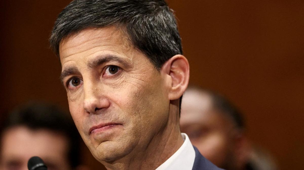 FILE PHOTO: Kevin Warsh, U.S. President Donald Trump's nominee to be next chair of the Federal Reserve, testifies before a Senate Banking Committee confirmation hearing on Capitol Hill in Washington, D.C., U.S., April 21, 2026. REUTERS/Kevin Lamarque/File Photo