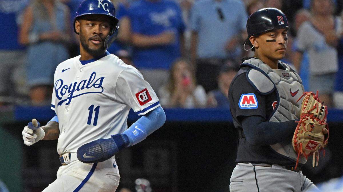 Jun 27, 2024; Kansas City, Missouri, USA; Kansas City Royals second baseman Maikel Garcia (11) scores a run past Cleveland Guardians catcher Bo Naylor (23) in the sixth inning at Kauffman Stadium.