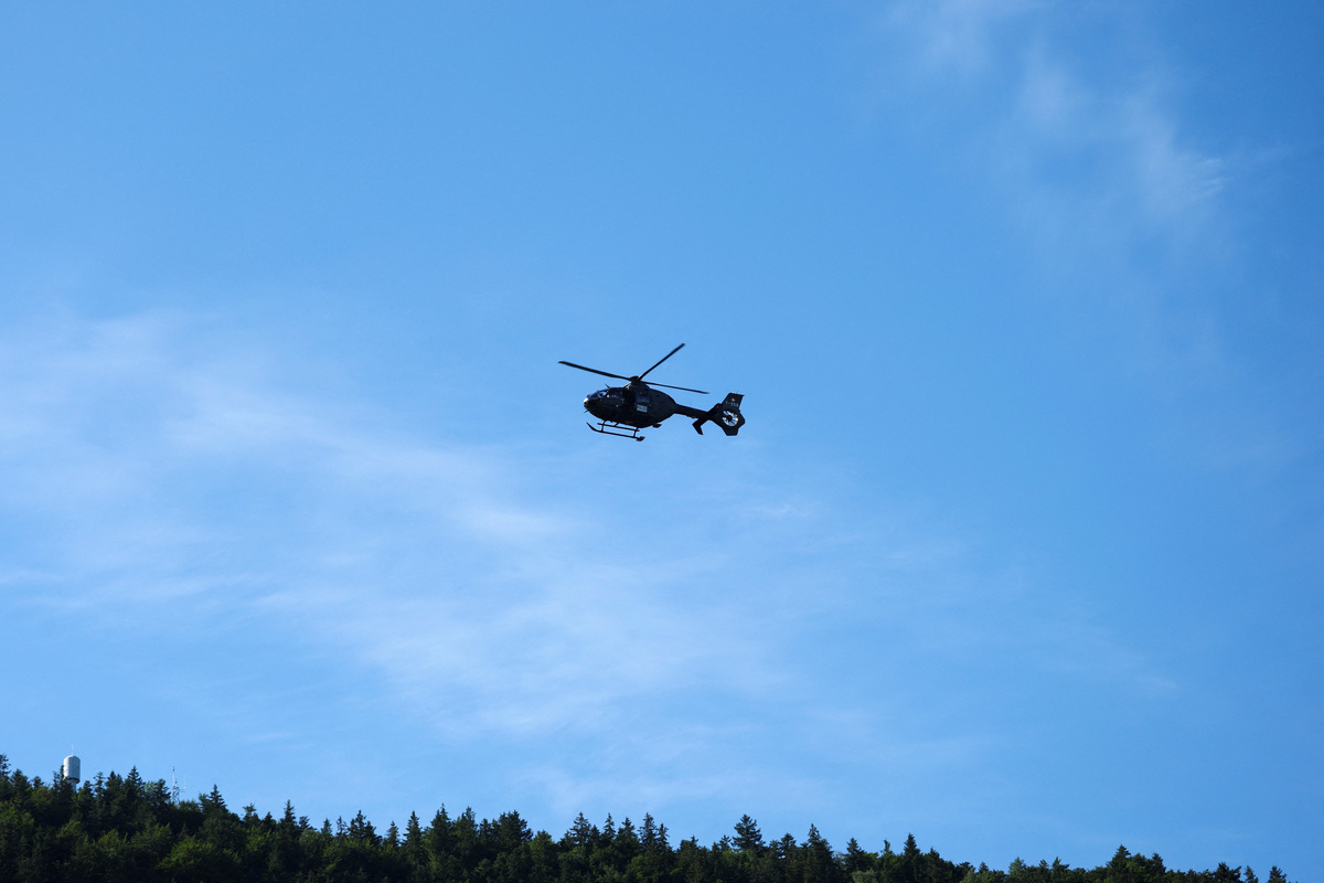 A Swiss army helicopter patrols over the Buergenstock Resort on the day of U.S.-Iran talks in Stansstad, Switzerland, June 21, 2026. REUTERS/Denis Balibouse