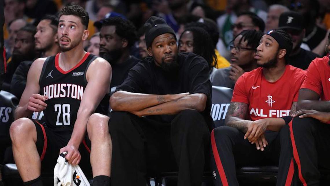  Apr 18, 2026; Los Angeles, California, USA; Houston Rockets center Alperen Sengun (28) and forward Kevin Durant (center) watch during the first half against the Los Angeles Lakers during game one of the first round of the 2026 NBA Playoffs at Crypto.com Arena. Mandatory Credit: Kirby Lee-Imagn Images | Kirby Lee-Imagn Images 