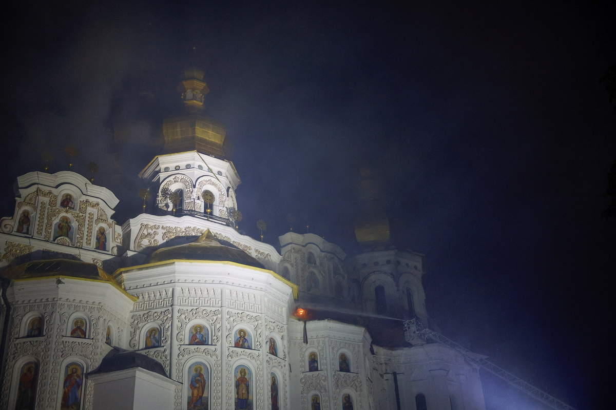 Firefighters work to extinguish a fire at the Dormition Cathedral of the Kyiv Pechersk Lavra, which was hit during Russian missile and drone strikes, amid Russia's attack on Ukraine, in Kyiv, Ukraine June 15, 2026. REUTERS/Valentyn Ogirenko