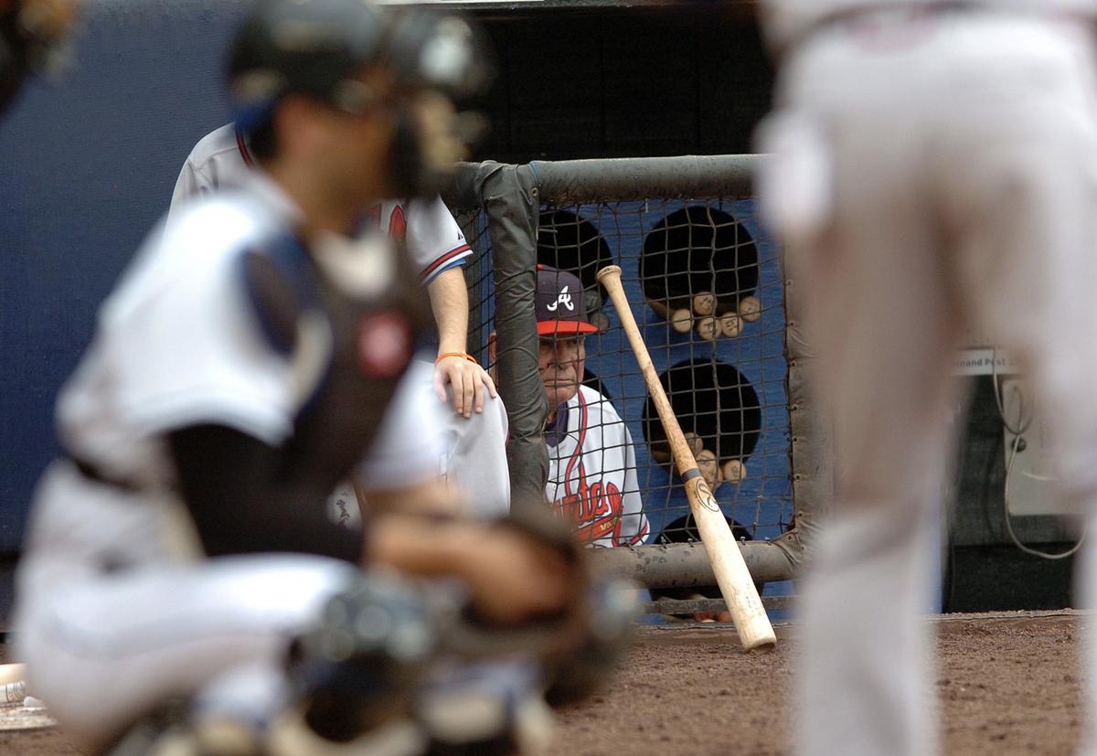 FILE-- The Atlanta Braves manager Bobby Cox watches his team from the dugout at Shea Stadium in Queens on July 17, 2005. Cox, a Hall of Famer who led the Atlanta Braves to five National League pennants and a World Series championship and ranks No. 4 for career victories as a manager, died in Marietta, Ga. on May 9, 2026. He was 84. (Suzy Allman/New York Times)