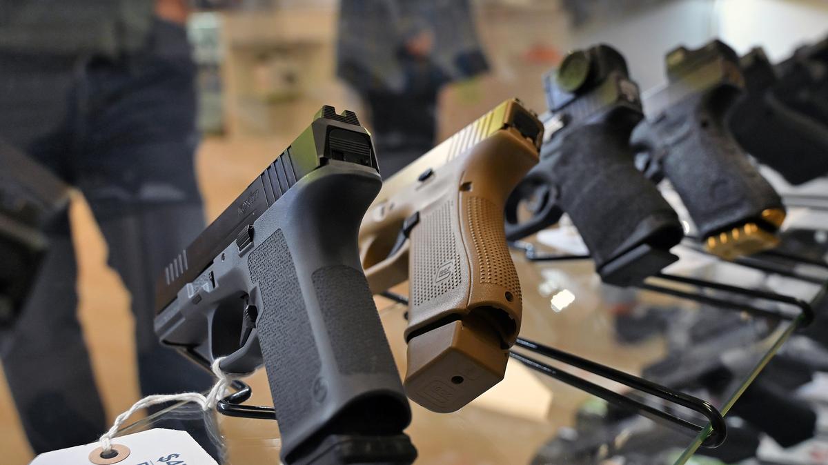 A Ruger RXM sits next to a Glock 19X in a Gundalk Weapon Works display case in  in Dundalk, Md. Maryland Gov. Wes Moore signed legislation banning manufacturing, sale and purchasing of handguns that can be easily converted into illegal semi-automatic weapons. (Kim Hairston/The Baltimore Sun/TNS)