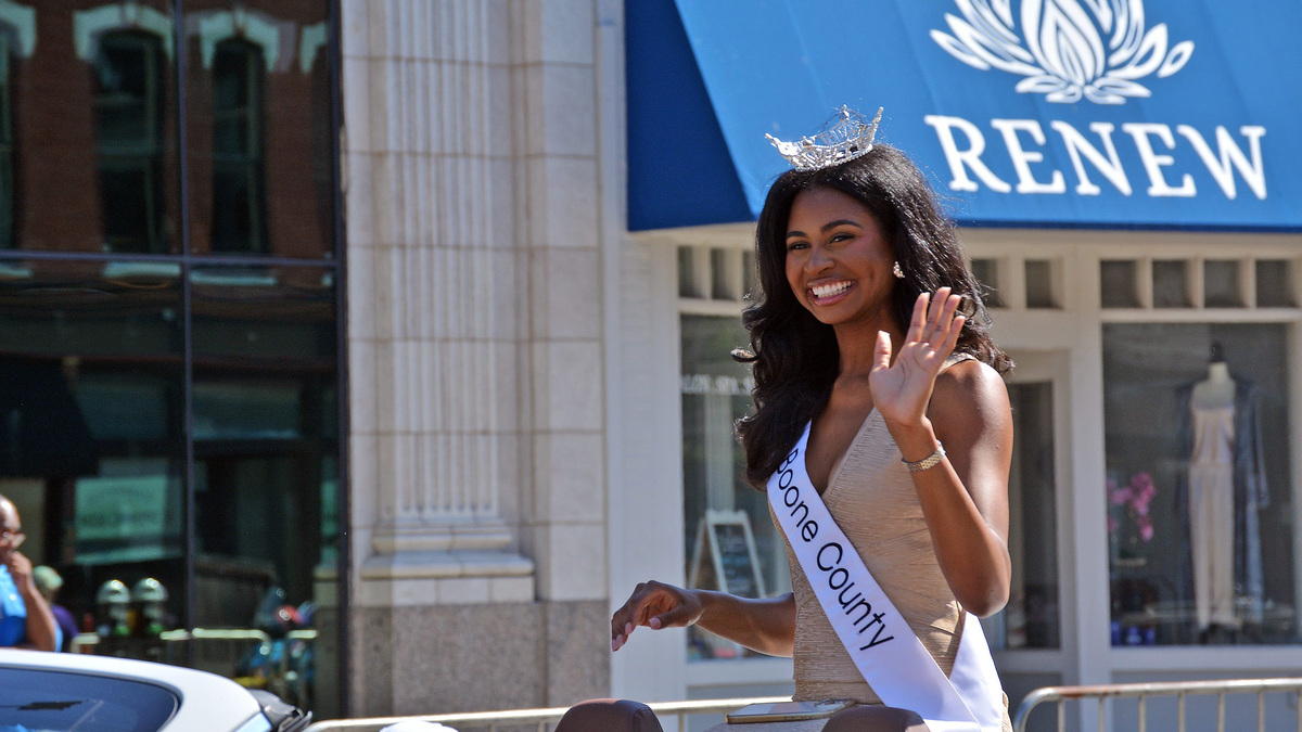 Miss Boone County Colleen Finney smiles and waves June 20, 2026 during the annual Junteenth parade in downtown Columbia. She was first runner-up in the recent Miss Missouri contest and is a University of Missouri graduate.