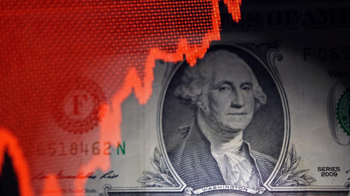 U.S. dollar banknote and rising stock graph are seen in this illustration taken April 25, 2025. REUTERS/Dado Ruvic/Illustration