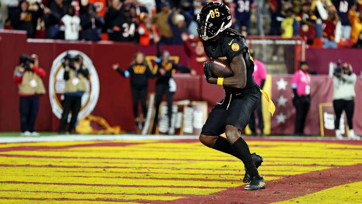  Oct 27, 2024; Landover, Maryland, USA; Washington Commanders wide receiver Noah Brown (85) catches a Hail Mary pass with no time left to beat the Chicago Bears at Commanders Field. Mandatory Credit: Peter Casey-Imagn Images | Peter Casey-Imagn Images 