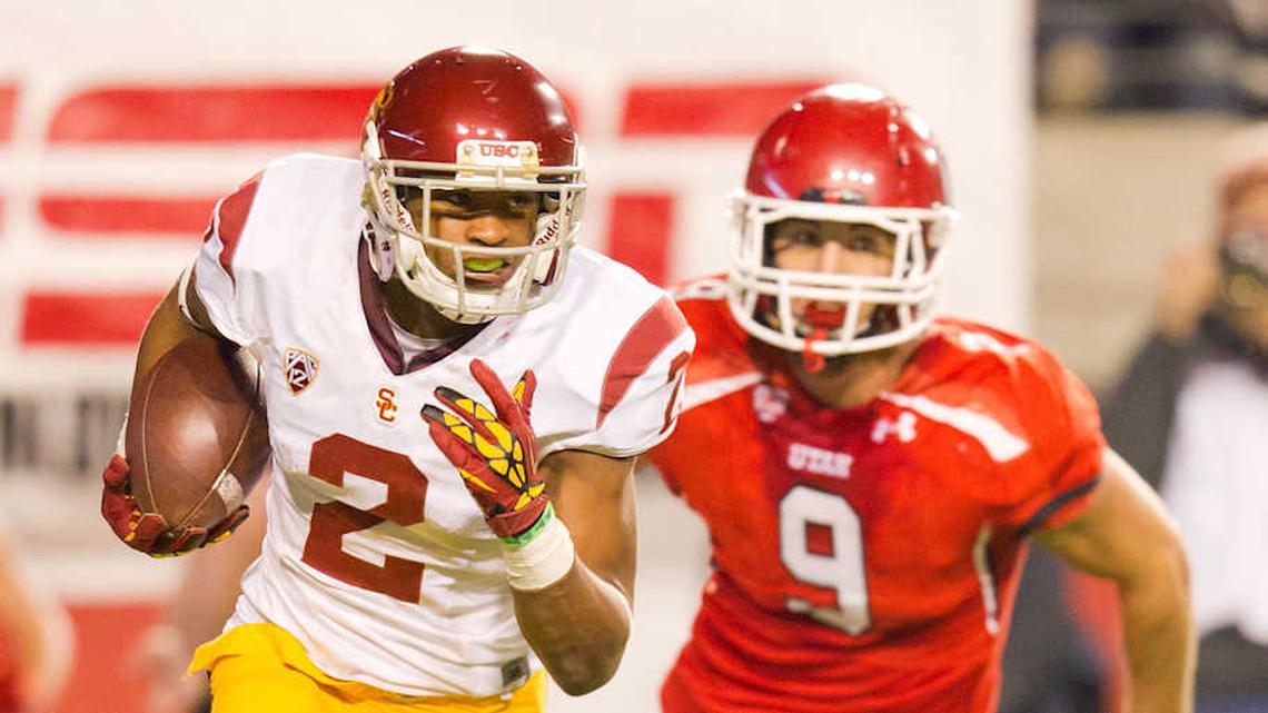  October 4, 2012; Salt Lake City, UT, USA; Southern California Trojans wide receiver Robert Woods (2) runs back a punt while pursued by Utah Utes linebacker Trevor Reilly (9) during the second half at Rice-Eccles Stadium. Southern California defeated Utah 38-28. Mandatory Credit: Russ Isabella-Imagn Images | Russ Isabella-Imagn Images 