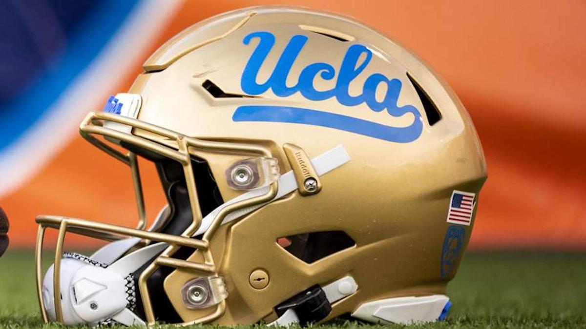  Dec 30, 2022; El Paso, Texas, USA; Helmets of the Pittsburgh Panthers and UCLA Bruins are posed in front of the logo before the 2022 Sun Bowl at Sun Bowl. Mandatory Credit: Ivan Pierre Aguirre-Imagn Images | Ivan Pierre Aguirre-Imagn Images 
