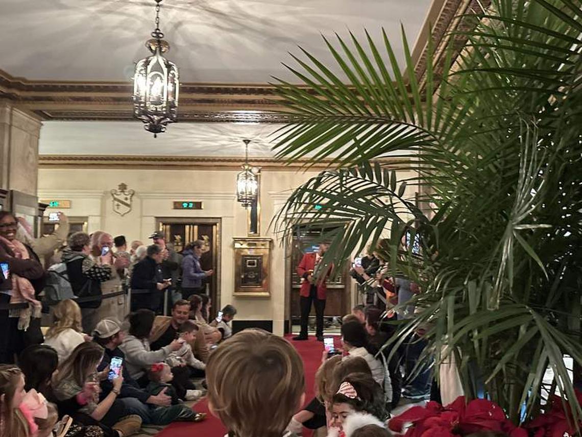  Families watching the ducks in the elevator and the Duckmaster saying farewell. Photo credit: Robin O’Neal Smith 