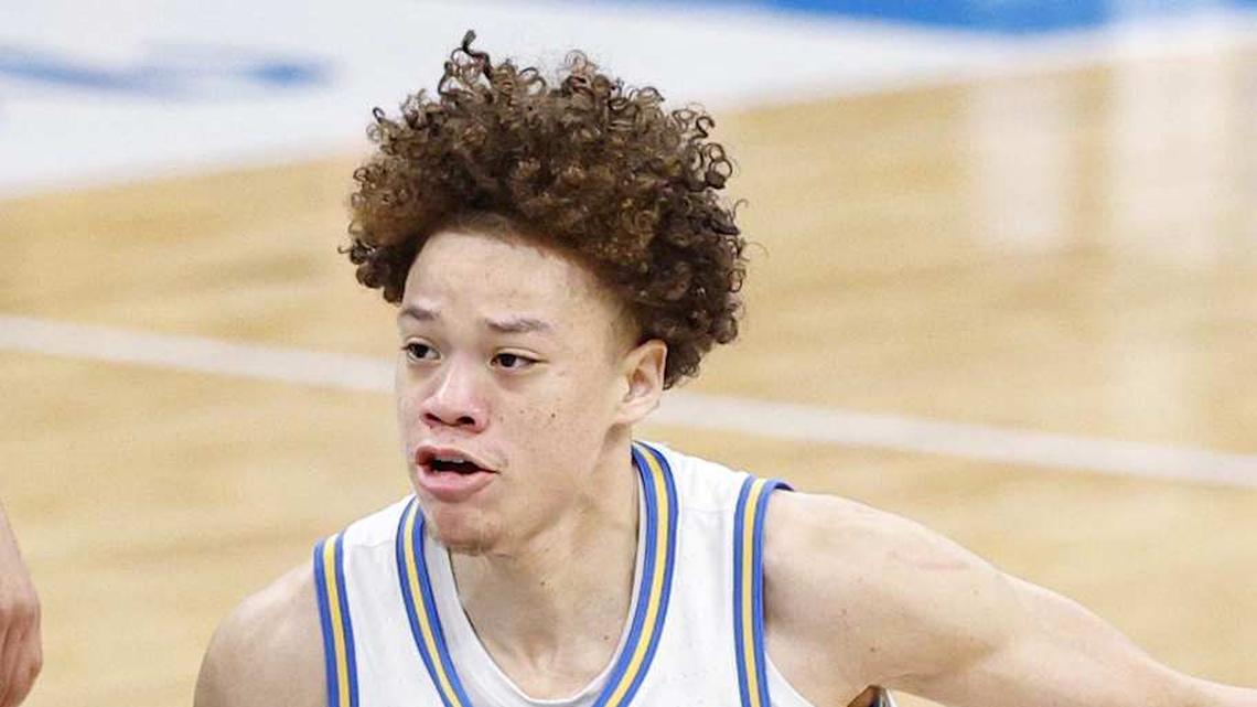  Mar 14, 2026; Chicago, IL, USA; UCLA Bruins guard Trent Perry (0) drives to the basket against Purdue Boilermakers forward Trey Kaufman-Renn (4) during the first half at United Center. Mandatory Credit: Kamil Krzaczynski-Imagn Images | Kamil Krzaczynski-Imagn Images 