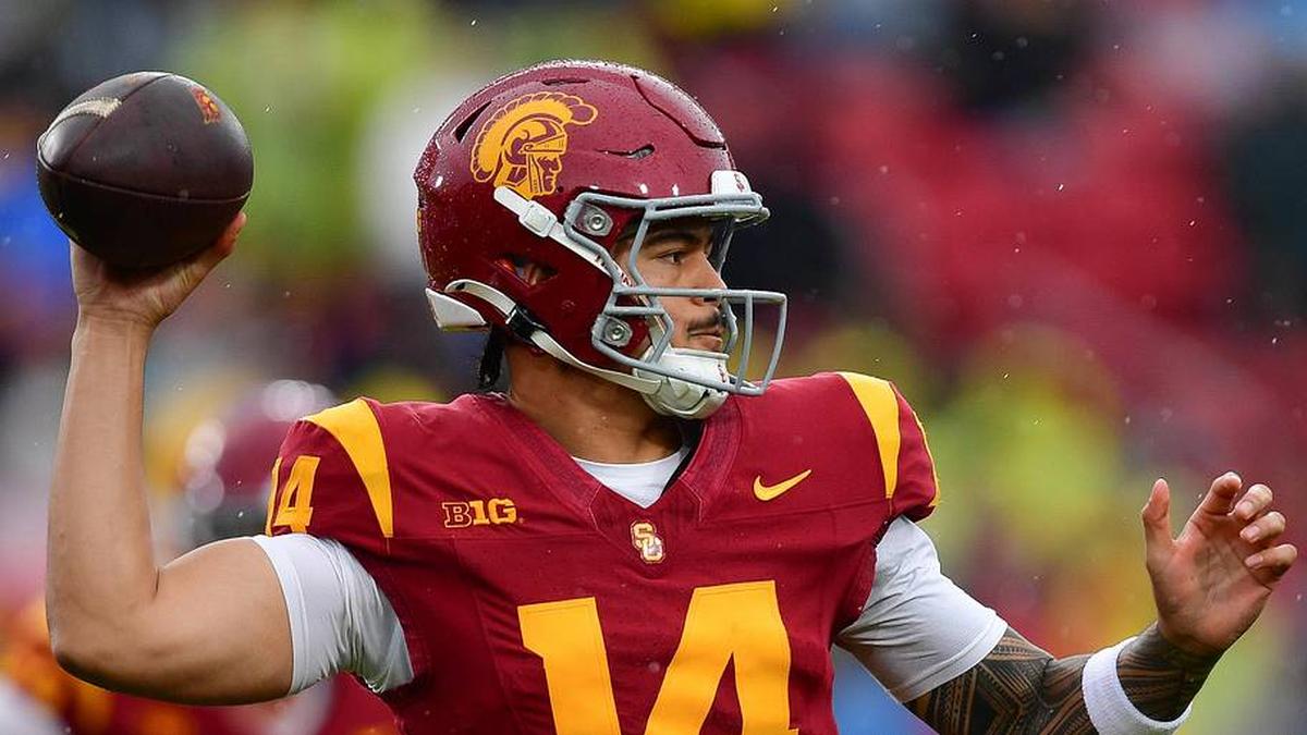  Nov 15, 2025; Los Angeles, California, USA; Southern California Trojans quarterback Jayden Maiava (14) throws against the Iowa Hawkeyes during the first half at the Los Angeles Memorial Coliseum. Mandatory Credit: Gary A. Vasquez-Imagn Images | Gary A. Vasquez-Imagn Images 