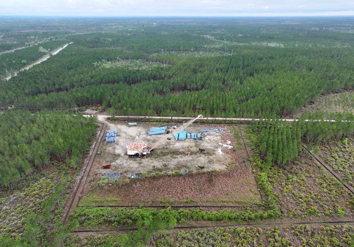 A drone photograph shows part of the Twin Pines mine site, where equipment is stationed, on Monday, March 18, 2024, in Charlton County, Georgia. The site is located less than 3 miles from the Okefenokee National Wildlife Refuge, the largest U.S. refuge east of the Mississippi River. The Georgia Environmental Protection Division has released draft permits to Twin Pines Minerals for a 582-acre mine that would extract titanium and other minerals from atop the ancient sand dunes on the swamp’s eastern border, which holds water in the refuge. (Hyosub Shin/The Atlanta Journal-Constitution/TNS)