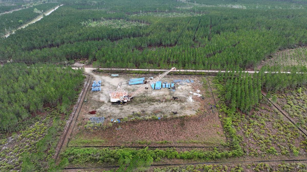 A drone photograph shows part of the Twin Pines mine site, where equipment is stationed, on Monday, March 18, 2024, in Charlton County, Georgia. The site is located less than 3 miles from the Okefenokee National Wildlife Refuge, the largest U.S. refuge east of the Mississippi River. The Georgia Environmental Protection Division has released draft permits to Twin Pines Minerals for a 582-acre mine that would extract titanium and other minerals from atop the ancient sand dunes on the swamp’s eastern border, which holds water in the refuge. (Hyosub Shin/The Atlanta Journal-Constitution/TNS)