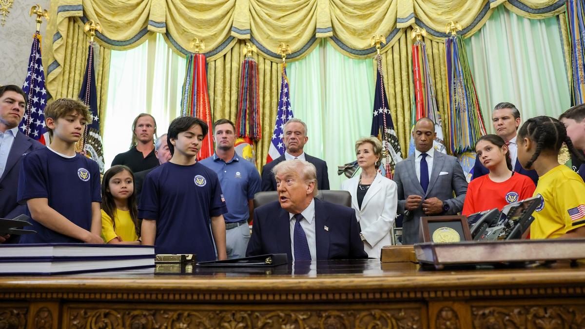 President Donald Trump speaks during a proclamation signing in the Oval Office of the White House on May 5, in Washington, DC. President Trump signed a presidential memorandum restoring the Presidential Fitness Test Award, which was reinstated by executive order in July 2025 and reintroduces a performance-based benchmark in physical education. 