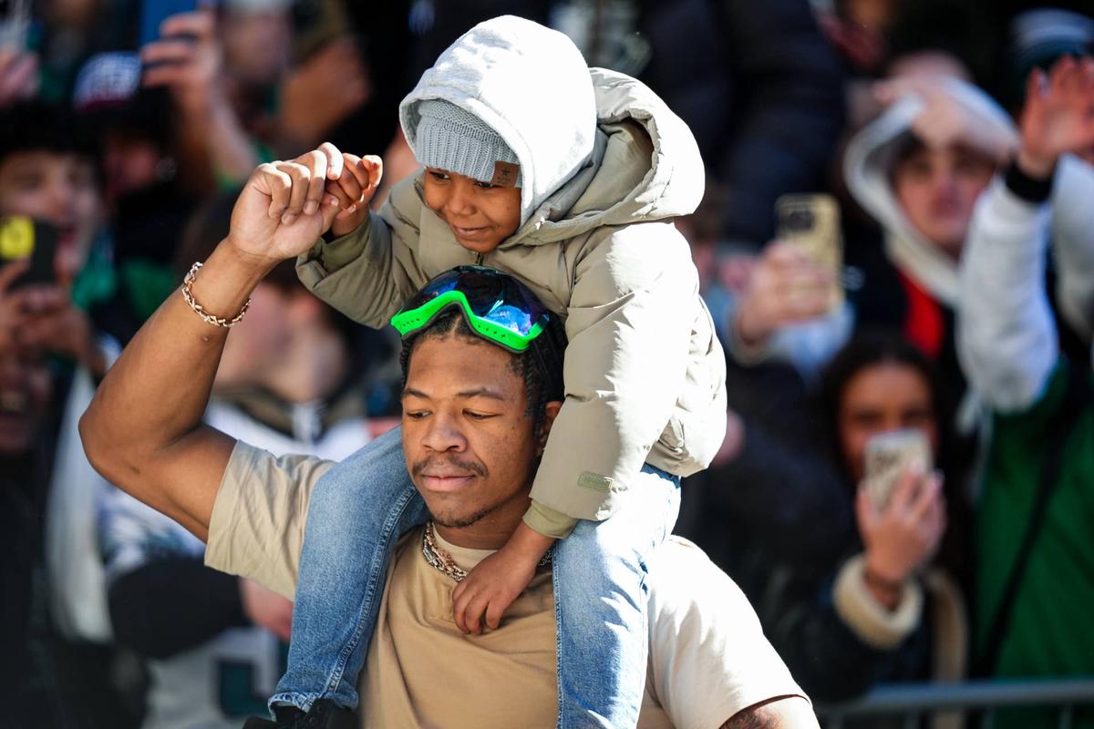  A fan sits on the shoulders of Nolan Smith Jr during the Super Bowl LIX championship parade. Kyle Ross-Imagn Images