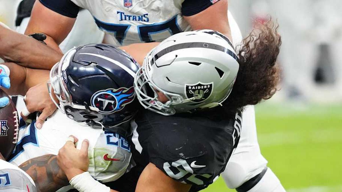  Oct 12, 2025; Paradise, Nevada, USA; Tennessee Titans running back Tony Pollard (20) is tackled during the second half against the Las Vegas Raiders at Allegiant Stadium. Mandatory Credit: Stephen R. Sylvanie-Imagn Images | Stephen R. Sylvanie-Imagn Images 