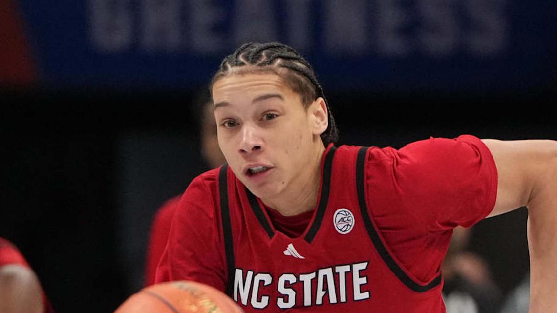  Mar 12, 2026; Charlotte, NC, USA; NC State Wolfpack guard Matt Able (3) and Virginia Cavaliers forward Devin Tillis (11) fight for the ball in the first half at Spectrum Center. Mandatory Credit: Bob Donnan-Imagn Images | Bob Donnan-Imagn Images 