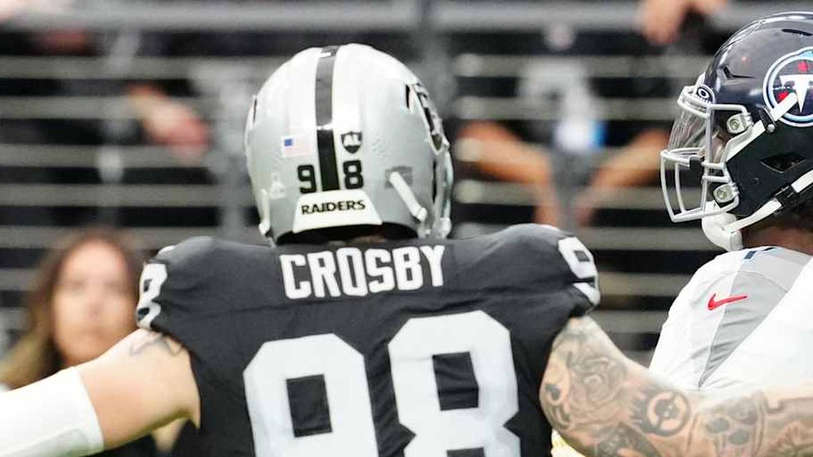  Oct 12, 2025; Paradise, Nevada, USA; Tennessee Titans quarterback Cam Ward (1) throws the ball away under pressure from Las Vegas Raiders defensive end Maxx Crosby (98) during the second half at Allegiant Stadium. Mandatory Credit: Stephen R. Sylvanie-Imagn Images | Stephen R. Sylvanie-Imagn Images 