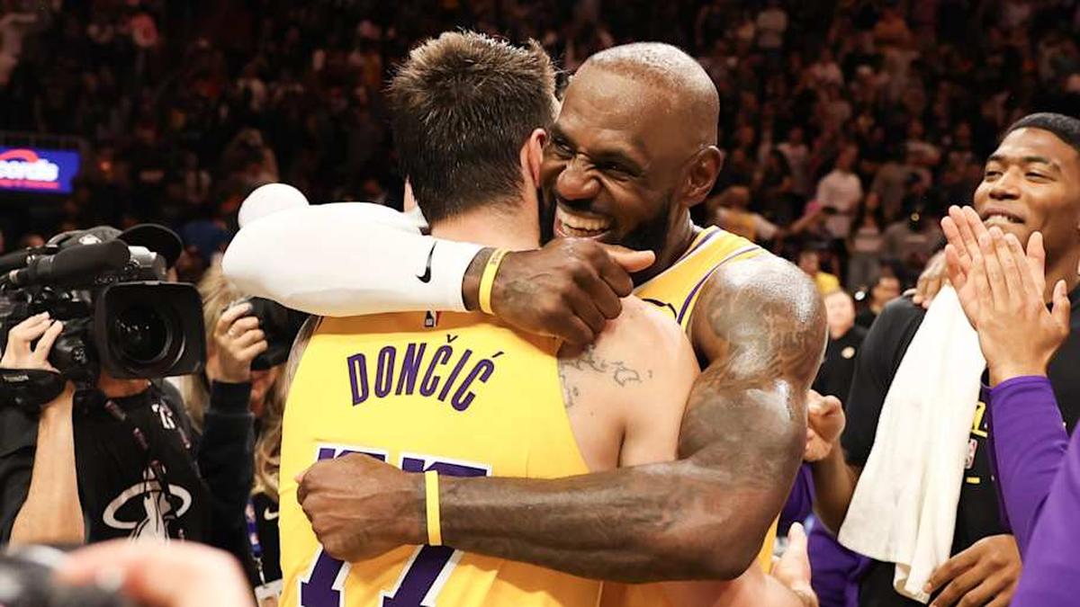  Mar 19, 2026; Miami, Florida, USA; Los Angeles Lakers forward LeBron James (23) celebrates with guard Luka Doncic (77) after 60 point game against the Miami Heat at Kaseya Center. | Isabella Frias-Imagn Images 