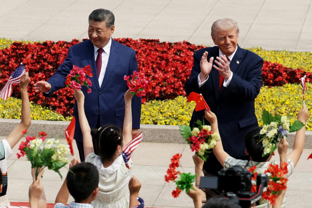  U.S. President Donald Trump and Chinese President Xi Jinping attend a welcome ceremony at the Great Hall of the People on May 14, 2026, in Beijing, China. Alex Wong/Getty Images 