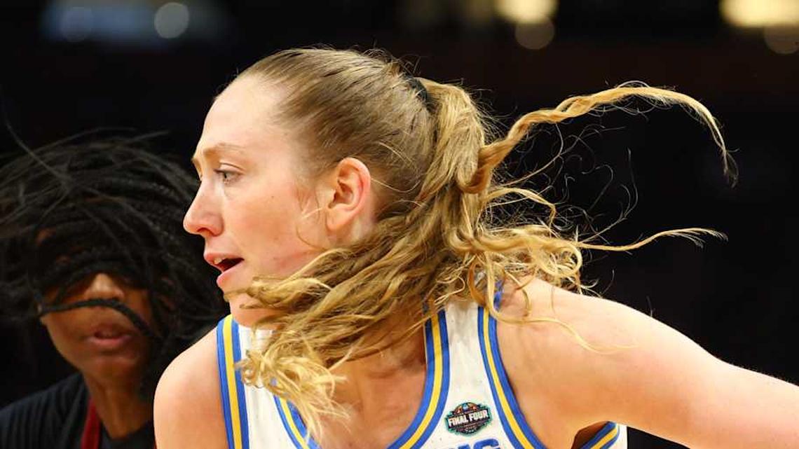  Apr 5, 2026; Phoenix, AZ, USA; UCLA Bruins guard Gianna Kneepkens (8) drives to the basket defended by South Carolina Gamecocks guard Ta'niya Latson (00) in the third quarter during the National Championship game of the women's 2026 NCAA Tournament at Mortgage Matchup Center. Mandatory Credit: Mark J. Rebilas-Imagn Images | Mark J. Rebilas-Imagn Images 