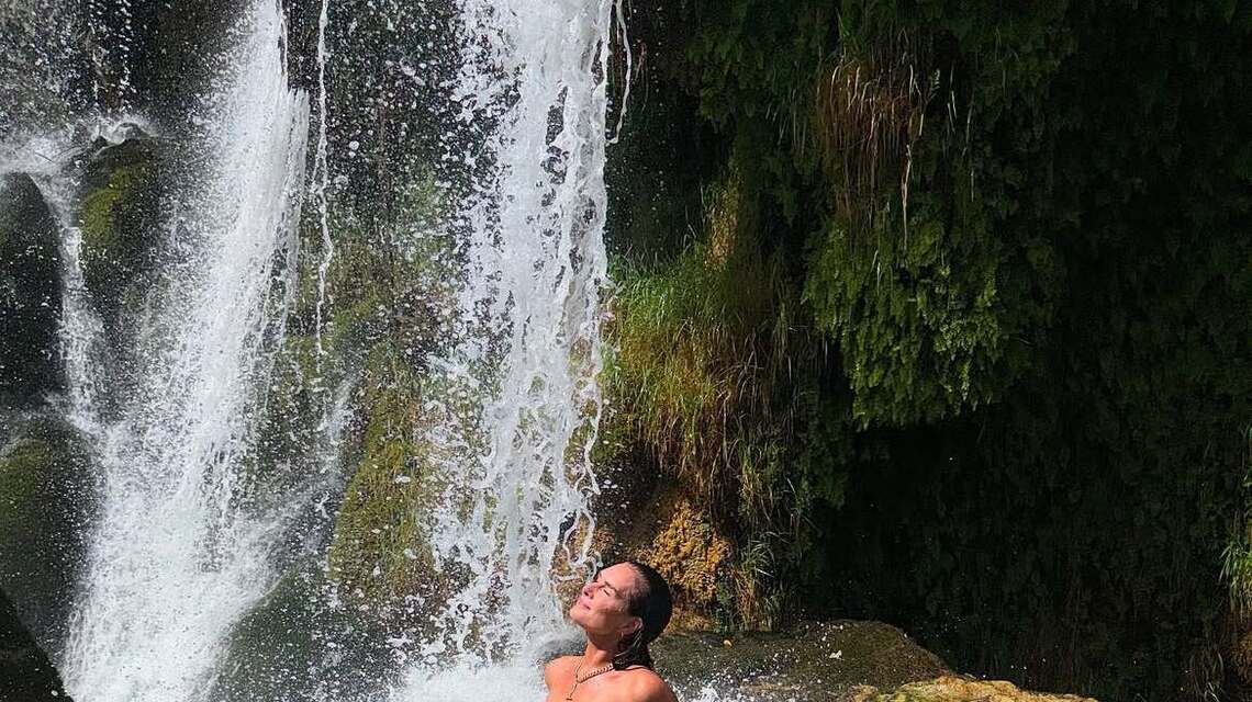 Brooke Shields Rocks Strapless Swimsuit While Posing Underneath Waterfall 