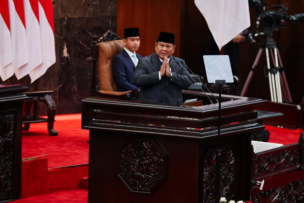 Indonesian President Prabowo Subianto gestures inside the parliament building, while Vice President Gibran Rakabuming Raka looks on near him, on the day Subianto is set to deliver his speech on economic policies and the 2027 fiscal plan in Jakarta, Indonesia, May 20, 2026. REUTERS/Willy Kurniawan