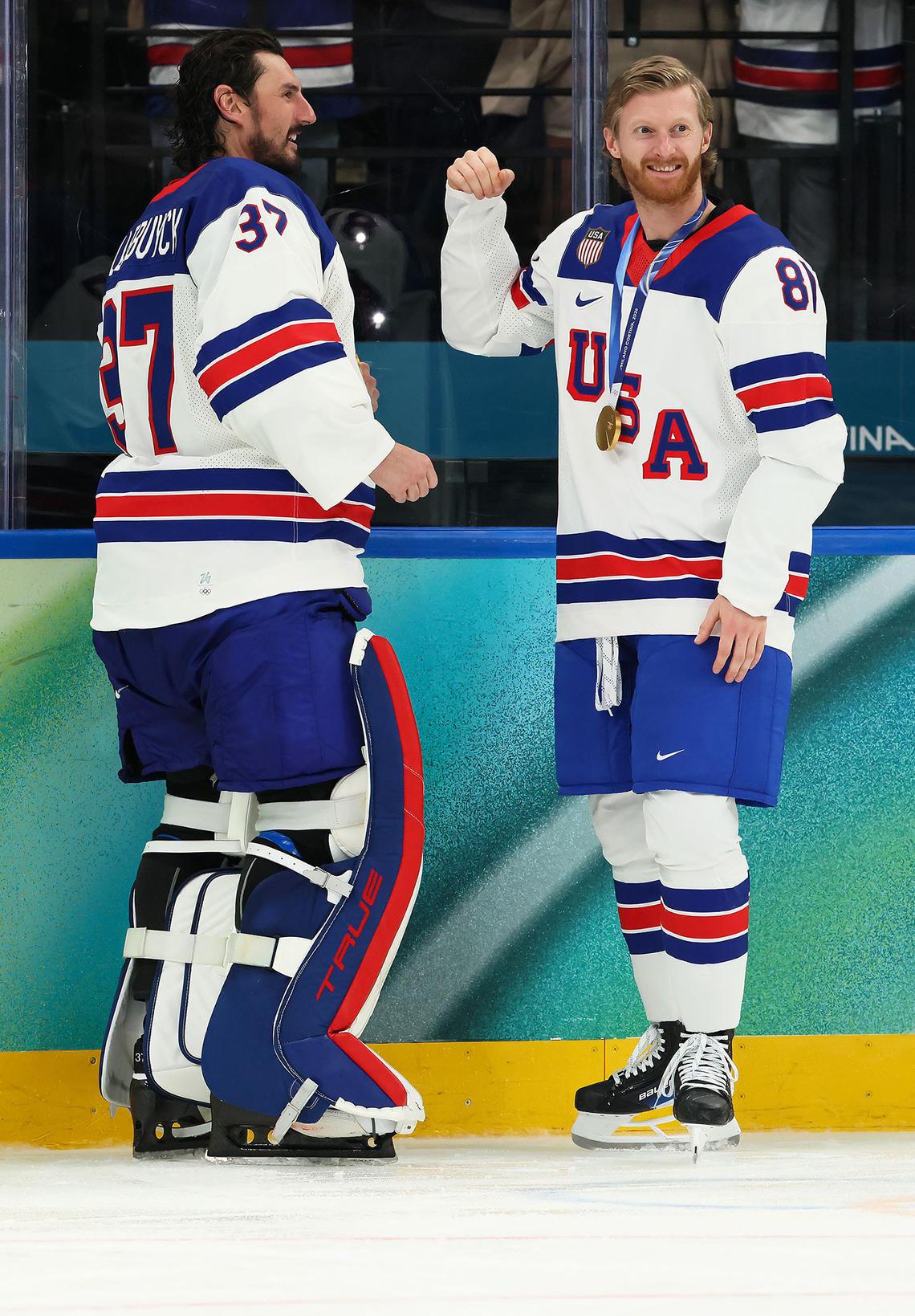  Connor Hellebuyck #37 and Kyle Connor #81 of Team United States celebrates following the Men's Gold Medal match between Canada and the United States on day 16 of the Milano Cortina 2026 Winter Olympic games at Milano Santagiulia Ice Hockey Arena on February 22, 2026 in Milan, Italy.Bruce Bennett/Getty Images 