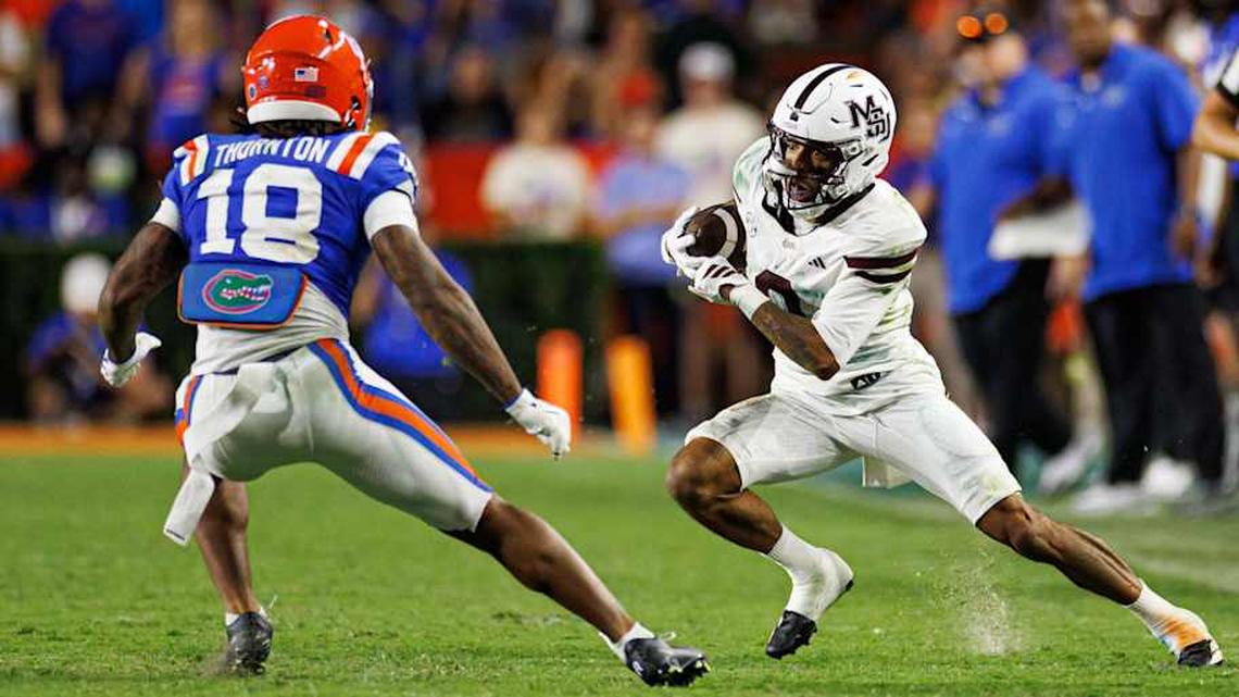  Oct 18, 2025; Gainesville, Florida, USA; Mississippi State Bulldogs wide receiver Brenen Thompson runs with the ball while Florida Gators safety Bryce Thornton (18) defends during the second half at Ben Hill Griffin Stadium. Mandatory Credit: Matt Pendleton-Imagn Images | Matt Pendleton-Imagn Images 