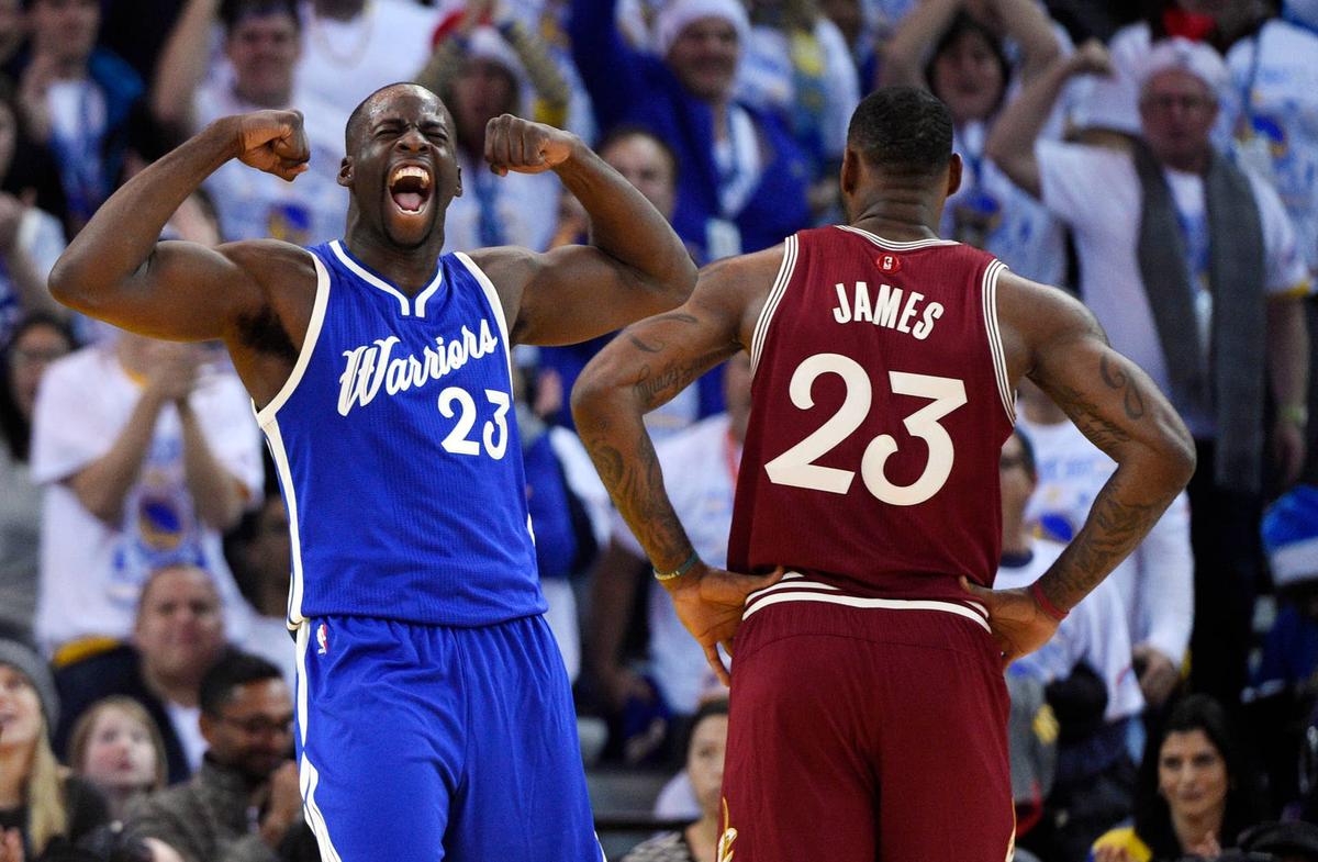  Dec 25, 2015; Oakland, CA, USA; Golden State Warriors forward Draymond Green (left) reacts as Cleveland Cavaliers forward LeBron James (right) looks on in the first half of a NBA basketball game on Christmas at Oracle Arena. Mandatory Credit: Kyle Terada-USA TODAY Sports 