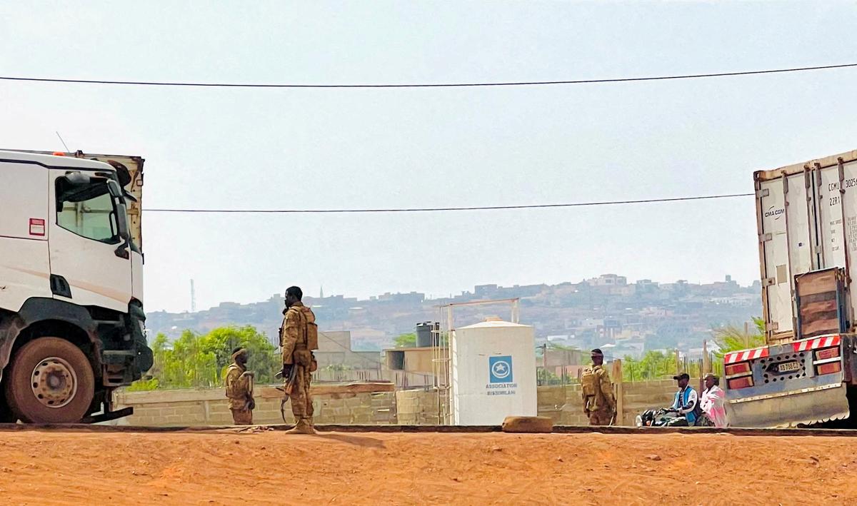 FILE PHOTO: Malian soldiers stand near a truck during a patrol following the attack on Mali's main military base Kati, outside the capital Bamako, in Kati, Mali, April 27, 2026. Picture taken with a mobile phone.   REUTERS/Stringer/File Photo