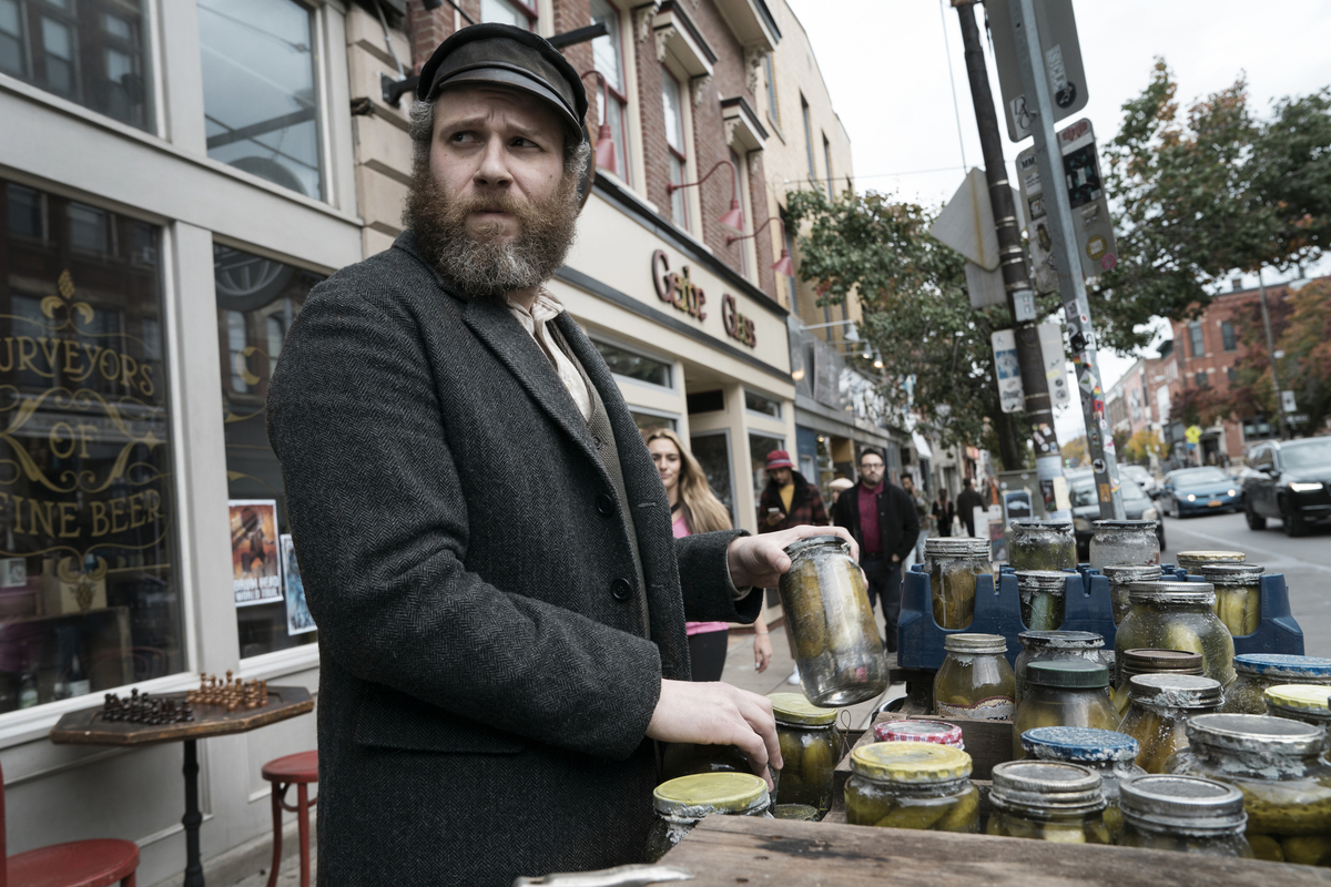 In “An American Pickle,” Seth Rogen plays a man who falls into a vat of pickle juice in 1918, wakes up fully preserved 100 years later and gets a chance to know his great-grandson, also played by Rogen.