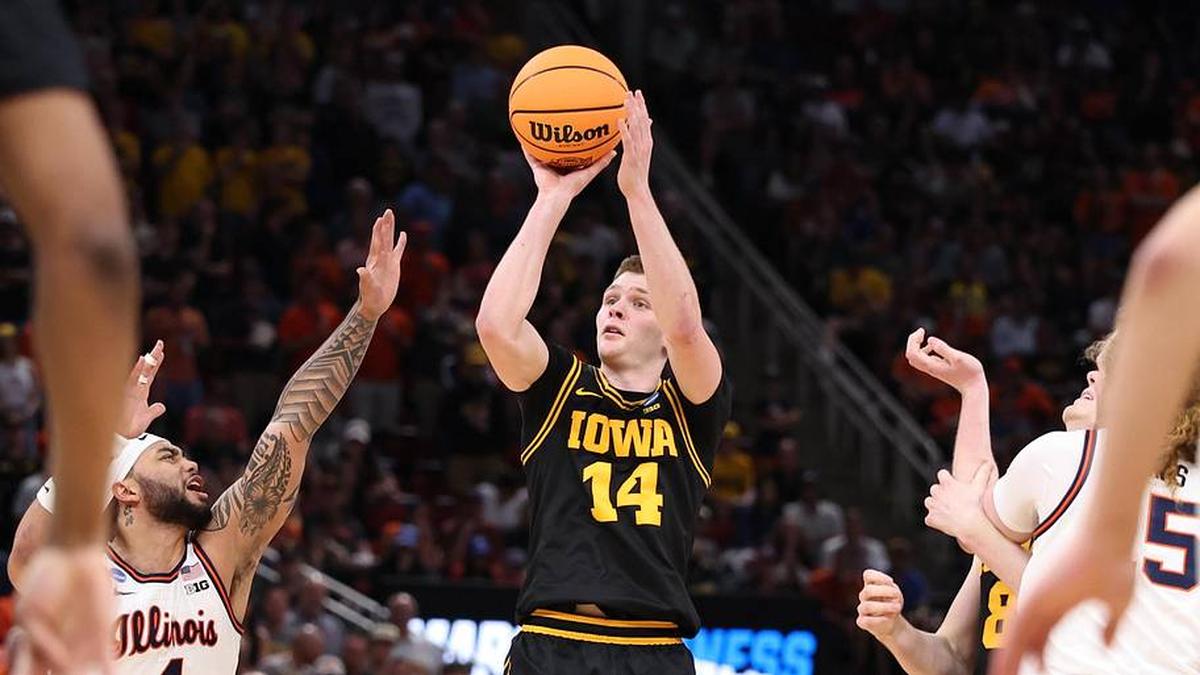  Mar 28, 2026; Houston, TX, USA; Iowa Hawkeyes guard Bennett Stirtz (14) shoots against Illinois Fighting Illini guard Kylan Boswell (4) in the second half during an Elite Eight game of the South Regional of the men's 2026 NCAA Tournament at Toyota Center. Mandatory Credit: Troy Taormina-Imagn Images | Troy Taormina-Imagn Images 