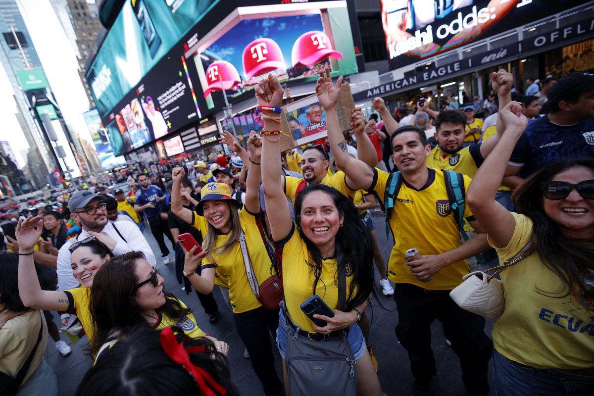  Ecuador fans celebrate after their team won the 2026 World Cup football tournament match between Ecuador and Germany, in Times Square, in New York City, on June 25, 2026. 