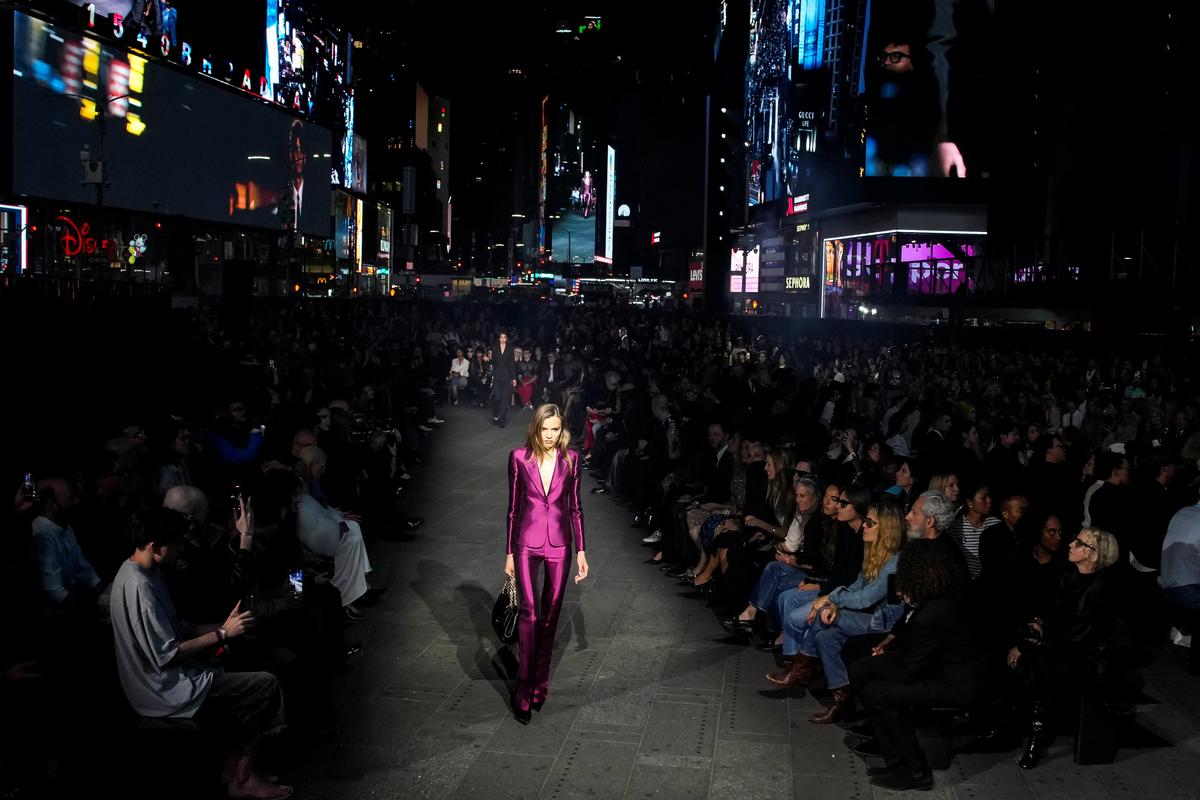 A model presents a creation from the Gucci Cruise 2027 collection at Times Square in New York City, U.S., May 16, 2026. REUTERS/Eduardo Munoz