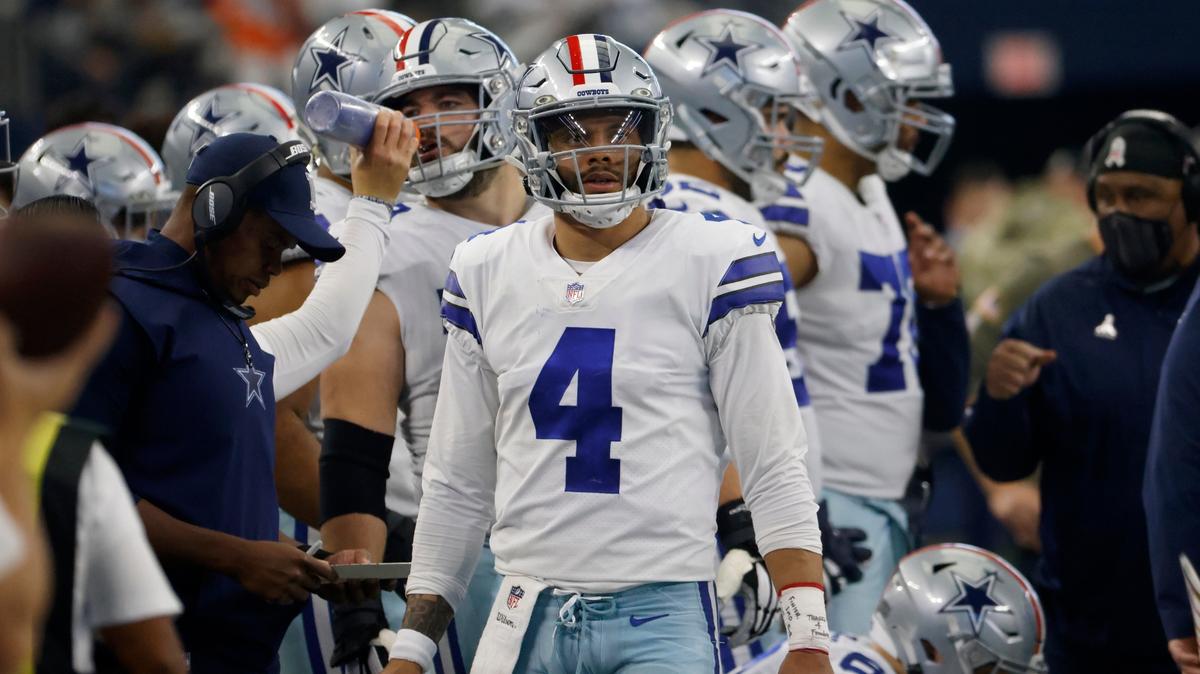 Dallas Cowboys quarterback Dak Prescott (4) stands on the sideline watching play against the Denver Broncos in the second half of an NFL football game in Arlington, Texas, Sunday, Nov. 7, 2021. (AP Photo/Ron Jenkins)