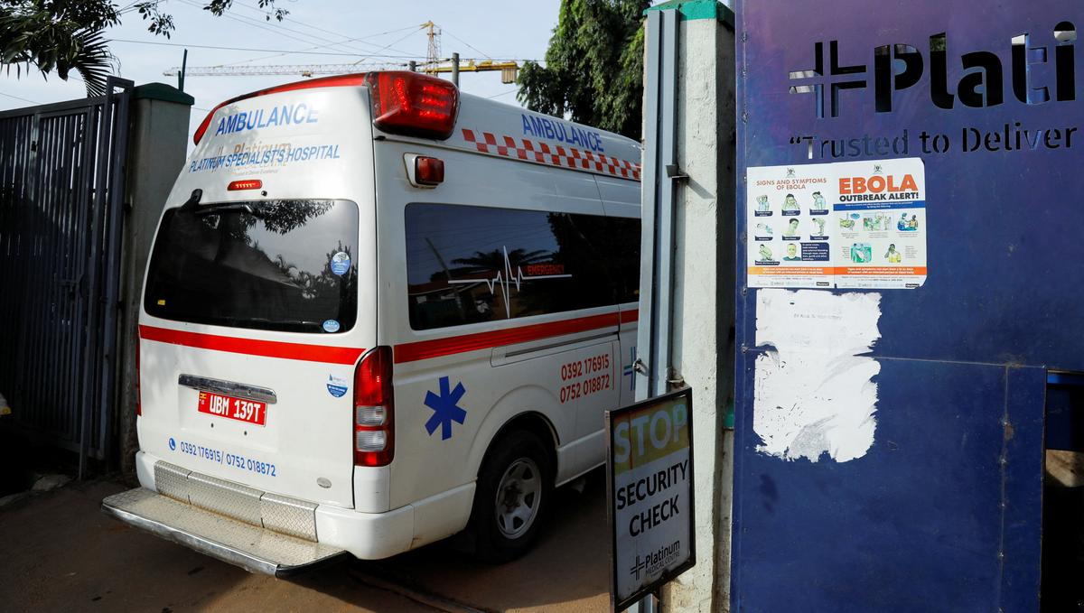 An ambulance drives past an advocacy poster against the spread of the Ebola virus, as aid agencies intensify efforts to contain a new Ebola outbreak involving the Bundibugyo Virus at the Platinum Medical Centre in Kampala, Uganda, May 26, 2026. REUTERS/Abubaker Lubowa